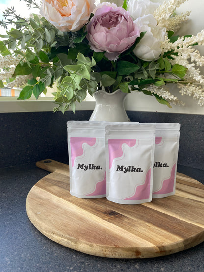 A set of three single serve Mylka powder pouches
