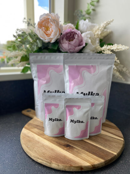 Mylka product packaging showcasing size difference between mutli-serve and single serve pouches.